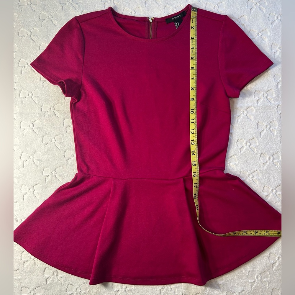 Rich magenta Forever 21 knit
Peplum top
Hardly worn EUC - Picture 2 of 3